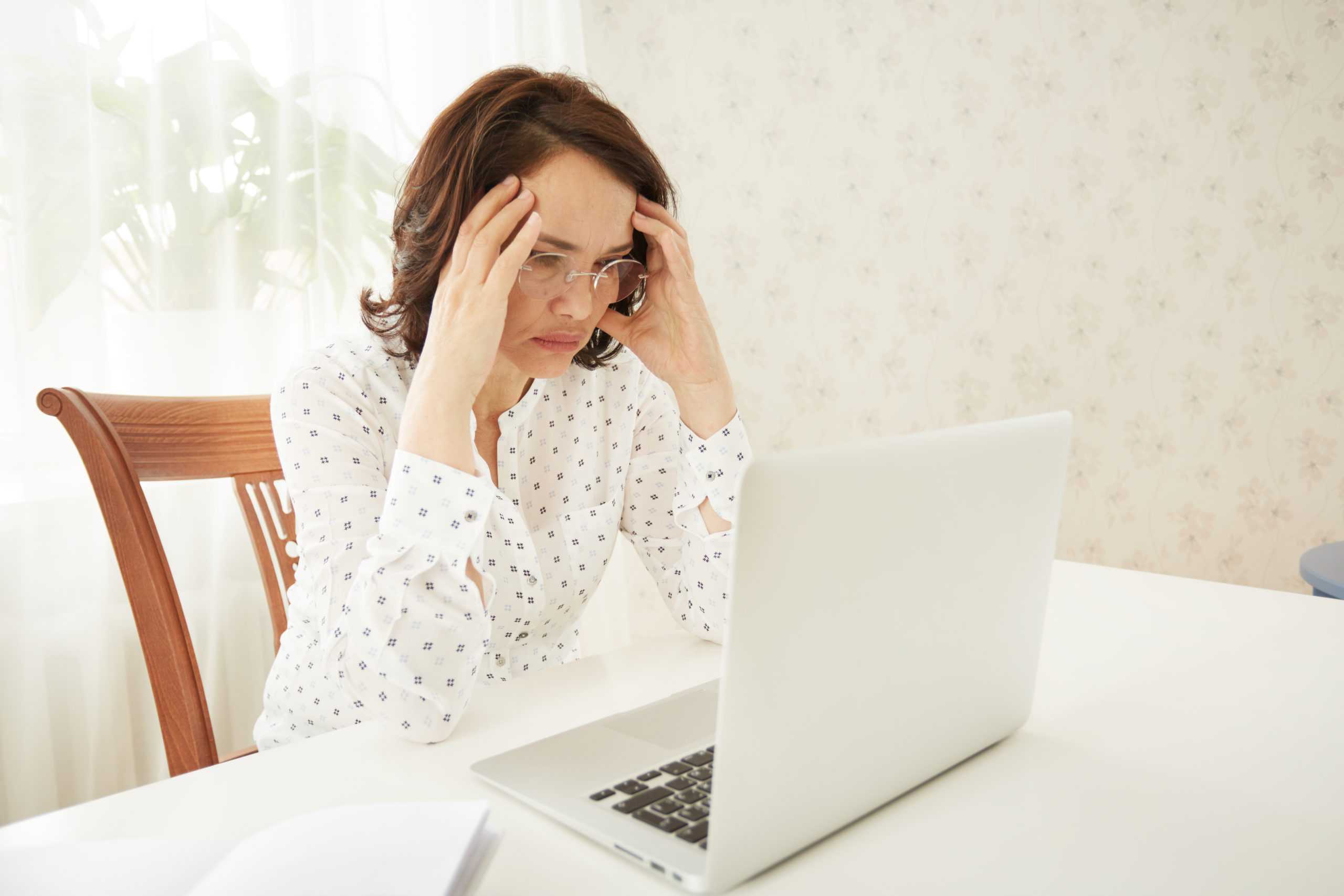 portrait-of-a-asian-mature-beautiful-businesswomen-thinking-or-brooding-scaled