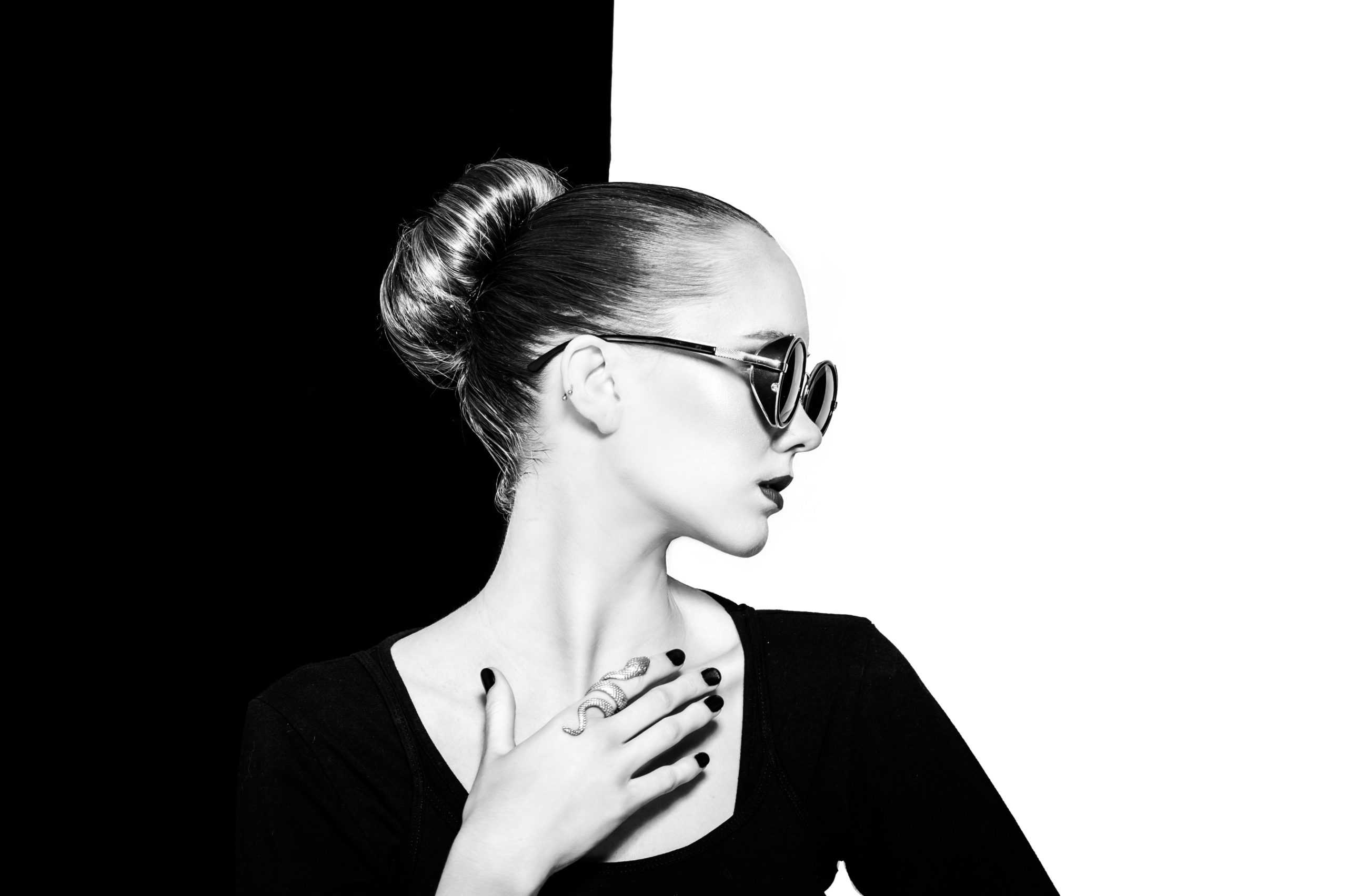 black-and-white-photo-of-a-woman-placing-her-hand-on-her-2877879-scaled