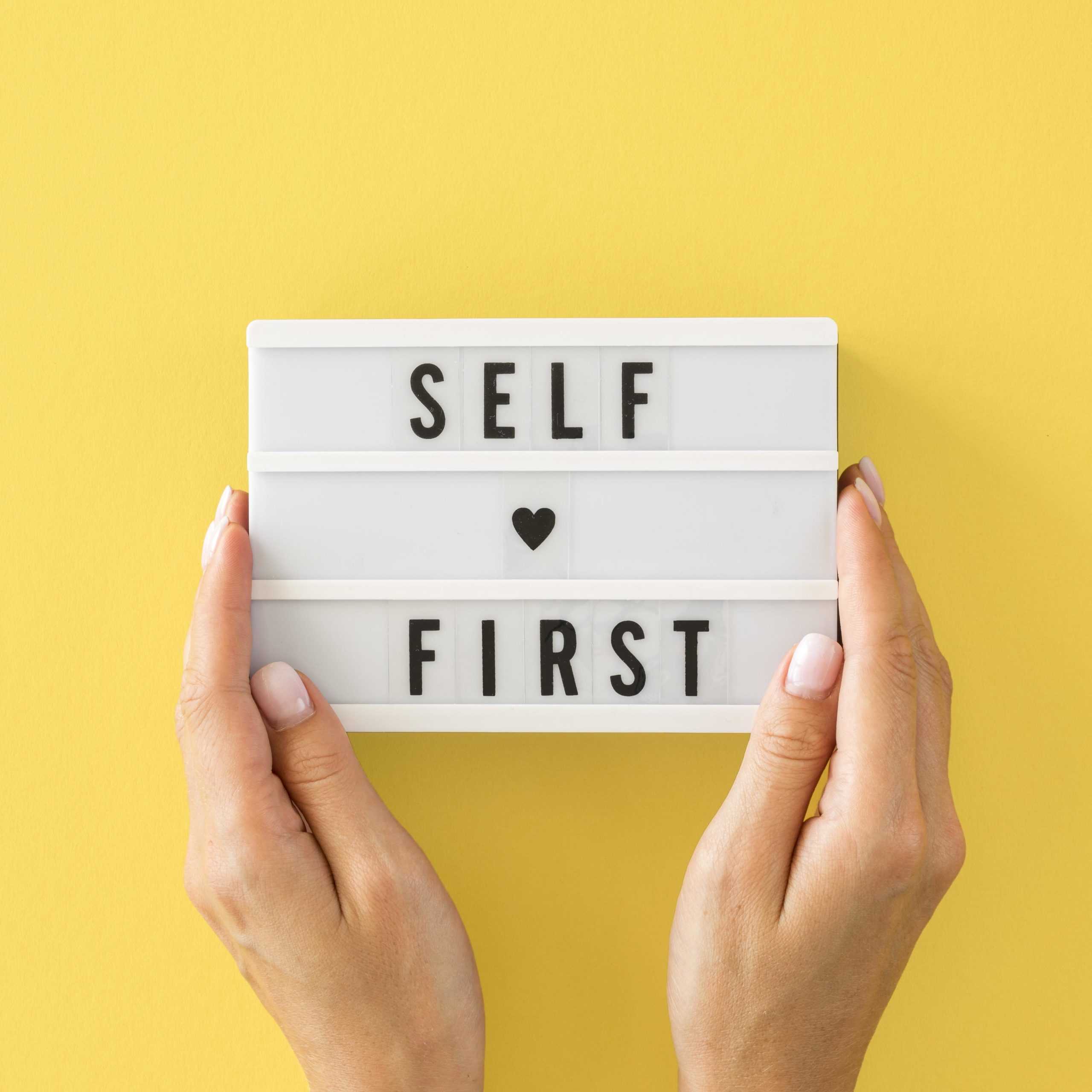 close-up-hands-holding-message-board-scaled